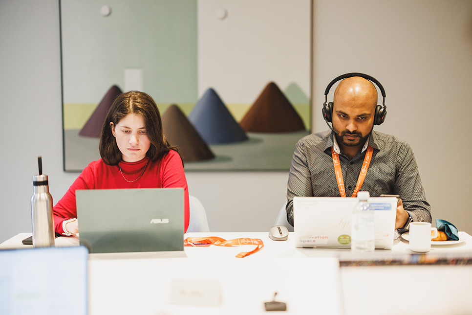 20241014_DBR2001 woman and man working on laptops